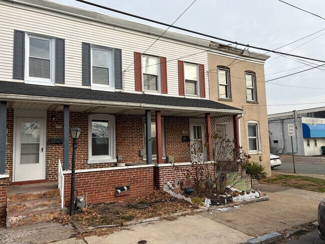 Building Photo - Newly Renovated 2- Story Townhome with Front Porch and Back Yard