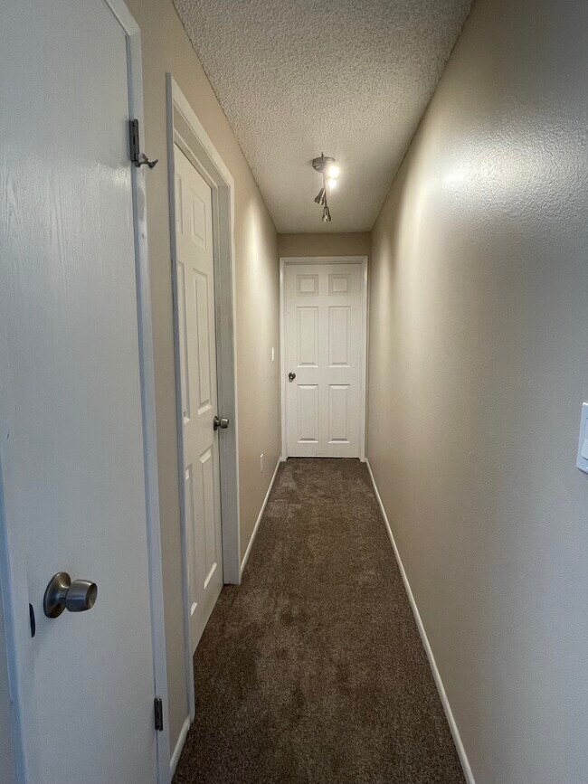 Hallway with new lighting and storage closet - 46398 Max Harder Rd N Unit Apt B