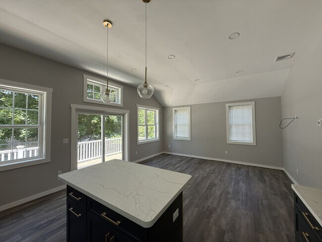 open floor plan living / dining / kitchen - 18 Montello St Unit 20M