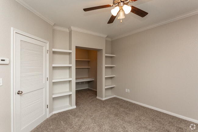 1BR, 1BA - 843SF Living Room With Built-In Shelving - The Oaks at Bentwater