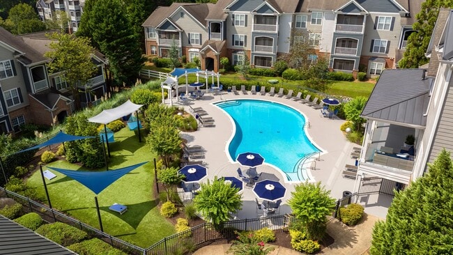 Dive into the excitement on our pool deck – from cornhole games to hammock hideaways and sizzling outdoor grills. - The Everlee Apartments