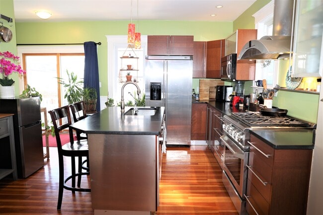 Kitchen with island - 57 Rogers Avenue Unit #1