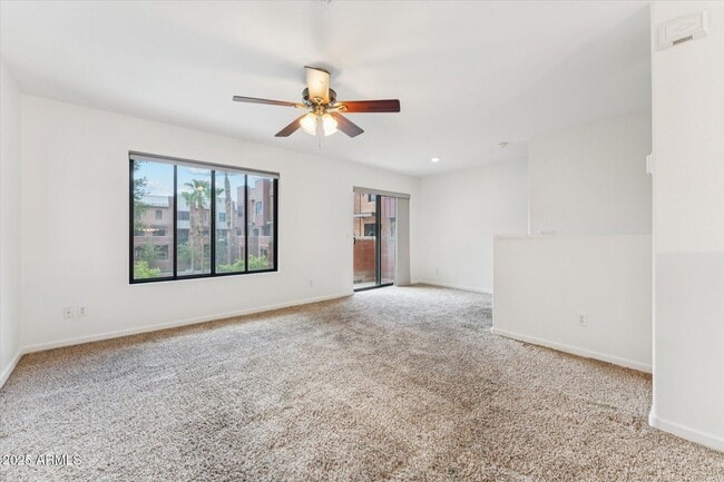 family room with balcony and view of pool and interior courtyard - 330 S Farmer Ave