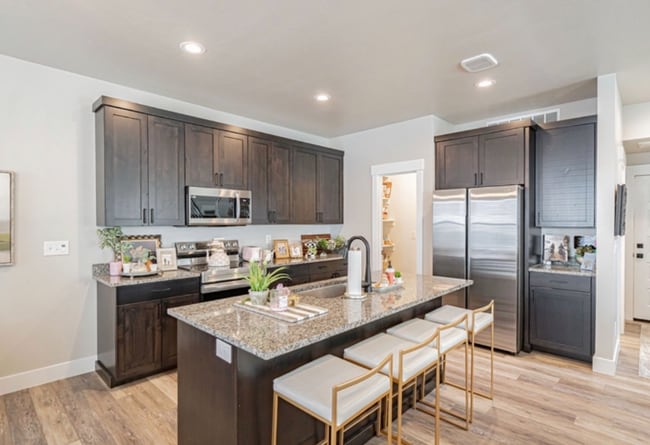 Photo - AWESOME END UNIT with attached 2 stall garage and additional personal parking spot on the exterior