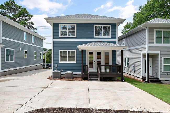 Redfield-Villages-Apartment-Homes-Near-NC-State-140-Faircloth-St-Exterior-Back-Deck-and-Driveway-Parking - Redfield Villages