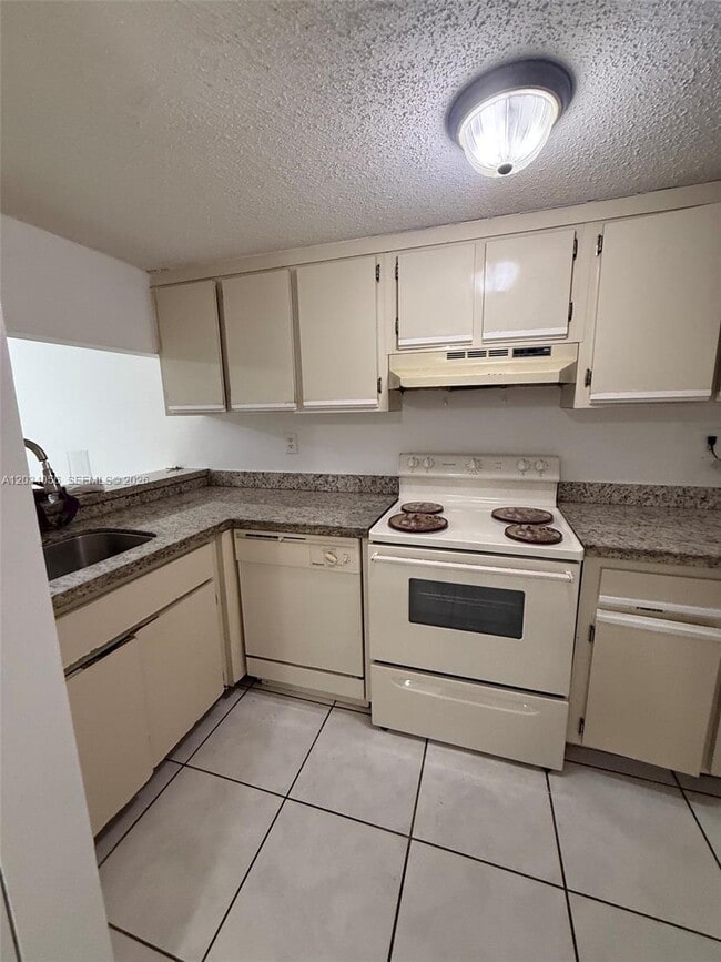Building Photo - 9917 W Okeechobee Rd Unit 3-510