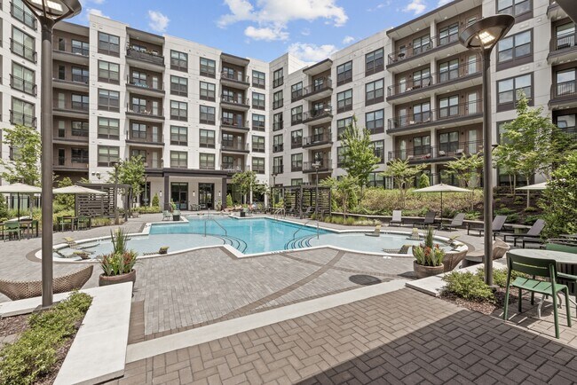 Resort-style Swimming Pool with Tanning Ledge, Cabanas and Sundeck - Bexley Chamblee