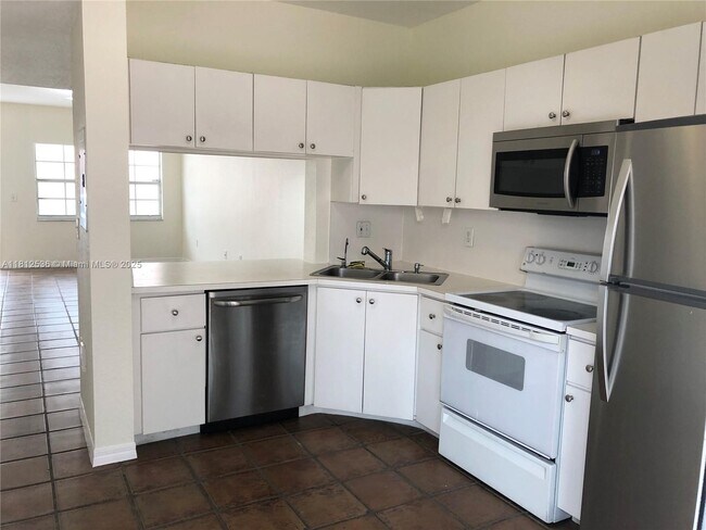 Photo - 9837 W Okeechobee Rd Condo Unit 401