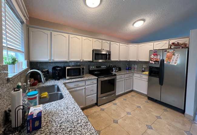 Photo - Beautifully Remodeled 5-Bedroom Home with Finished Basement and Custom Upgrades!