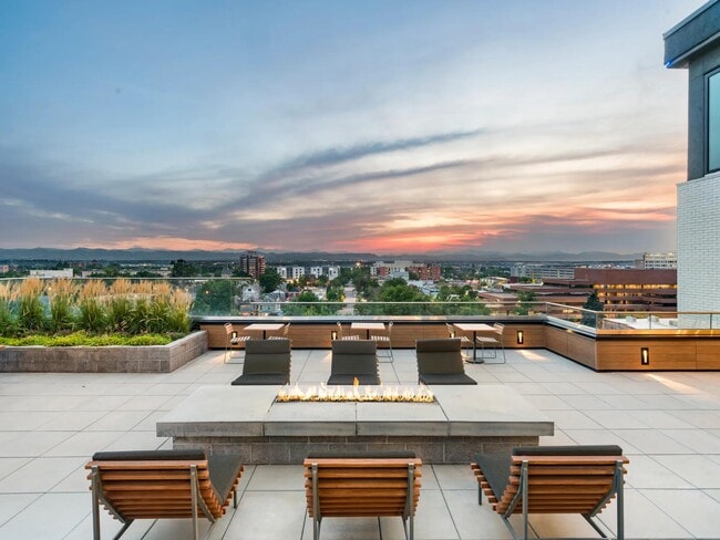 Rooftop fire pit lounge with sweeping mountain views and a front-row seat to Denver sunsets.