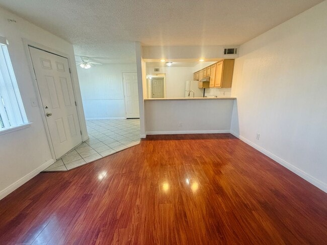 Photo - Super central 2 bedroom condo with tile & laminate flooring and in unit laundry! Home is very con...