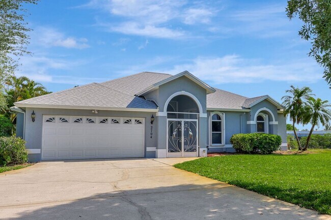 Photo - A BOATER'S PARADISE WITH THIS STUNNING 3 BEDROOM, 2 BATH WATERFRONT POOL HOME W/DOCK & BOAT LIFT ...