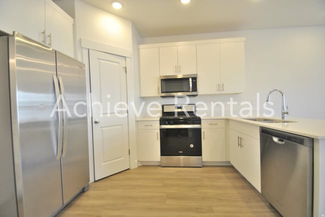 Photo - Woodmore Pointe HOA | Modern Logan Townhome in Prime Location
