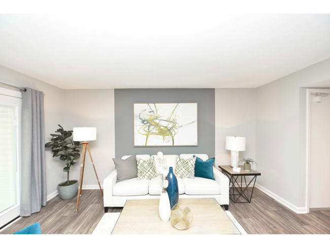 Spacious living room with hardwood-style flooring