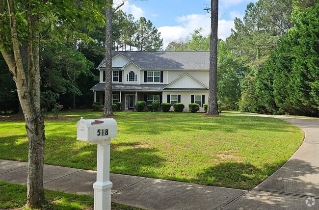 Building Photo - Commanding Curb Appeal, Conveniently Place Rental