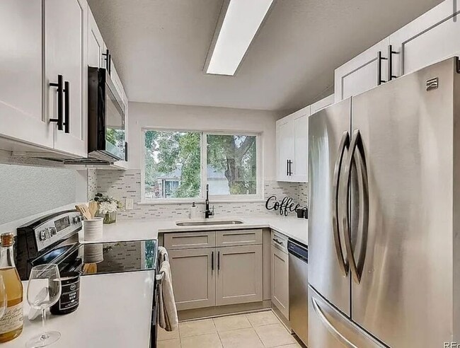 Photo - 7110 E 63rd Ave