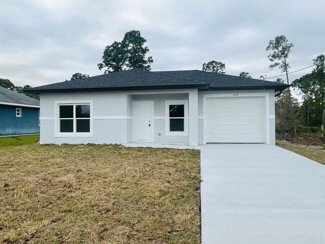 Building Photo - Brand-New Modern 2BR/2BA Home with Garage – Desirable Lehigh Acres Location