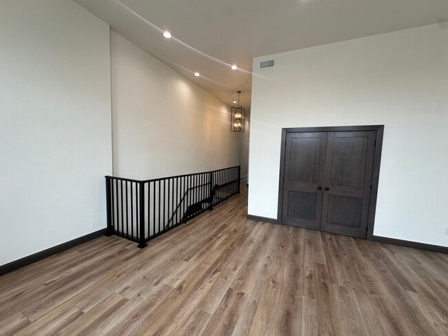 Living room looking back towards bedroom and entry. - 210 S Main St Unit 210 S Main St