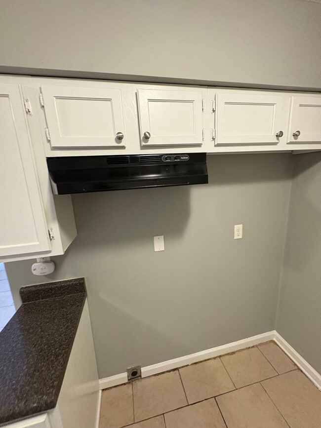 Photo - This 2BR/1BA includes a nice-sized living area, an ample kitchen, a fenced-in