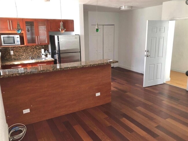 Building Photo - 7334 Harding Ave Unit 9 Rental