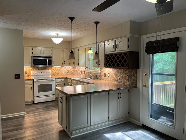 Photo - "Charming 2-Bed, 2.5-Bath Townhouse Retreat in Nashville - 1,242 Sq. Ft. of Comfort!"
Lawn Care I...