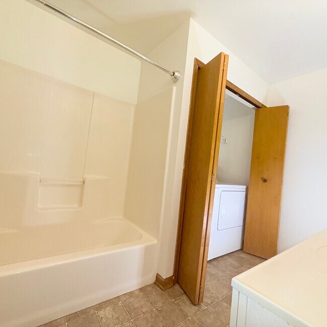 Spacious bathrooms with tub/shower combo and varied layouts.