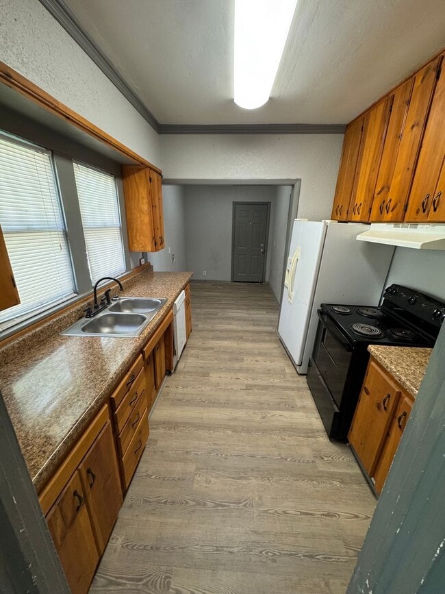 Photo - Three bedroom two bath home with central heat and air, large fenced backyard, and carport!