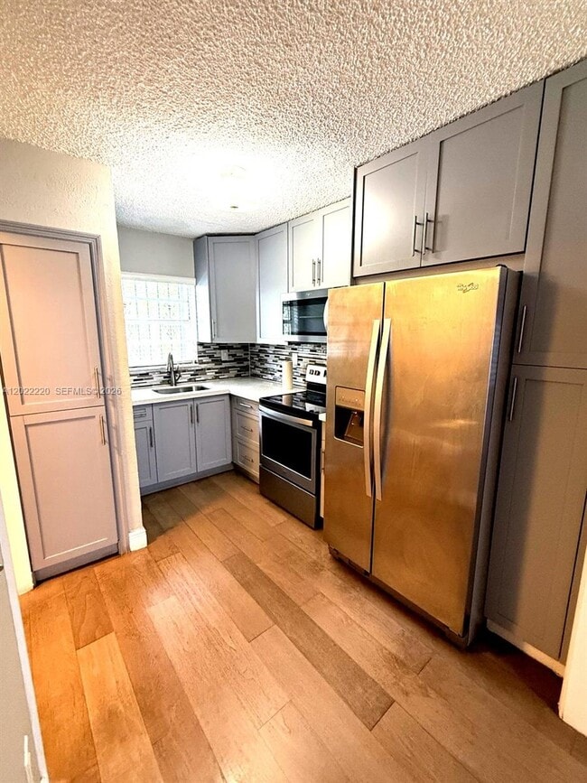 Building Photo - 1635 W 44th Pl Unit 311