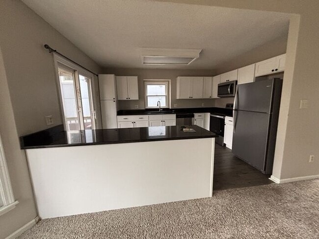 Photo - 3BR/2BA w/ Fenced Yard + Patio/Deck and 2-Car Garage in Olathe