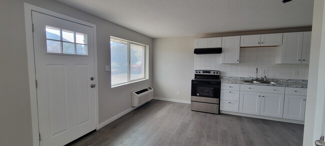 Front foor, area for nook and partial kitchen photo - 254 E 500 N Townhome