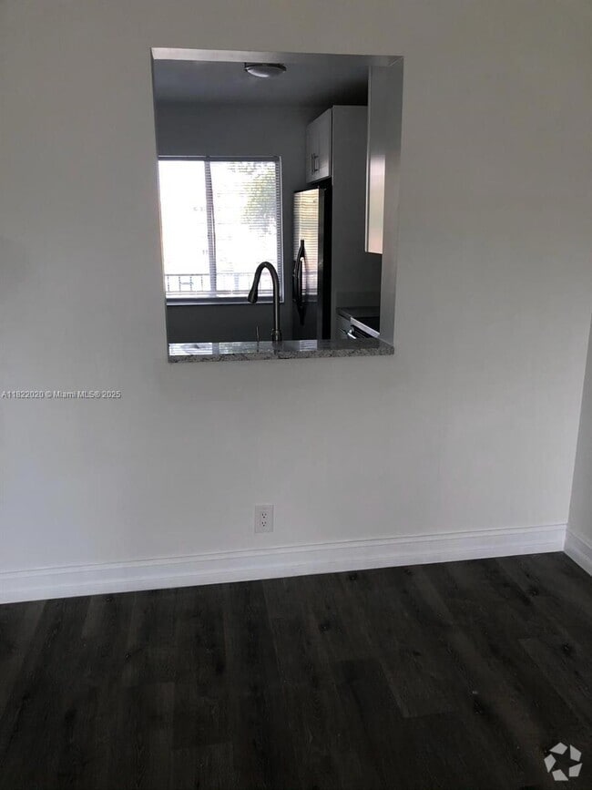 Building Photo - 8550 N Sherman Cir Unit 306 Rental
