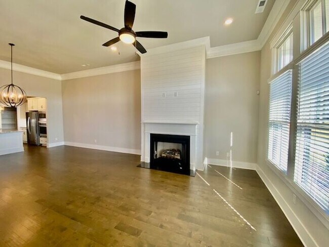 Photo - Clift Farm townhome with a fence and 3 car garage