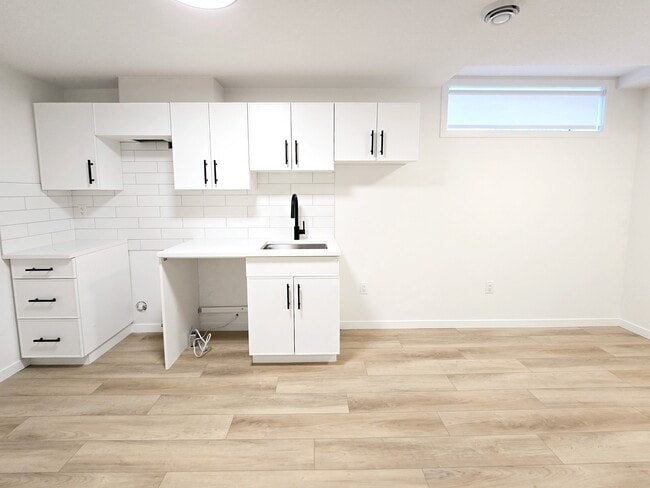 Building Photo - 11919-11955 55 St NW Unit BSMT 2