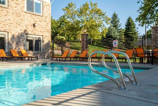 Relax and unwind by the swimming pool on sunny afternoons. - Grand Legacy Rental