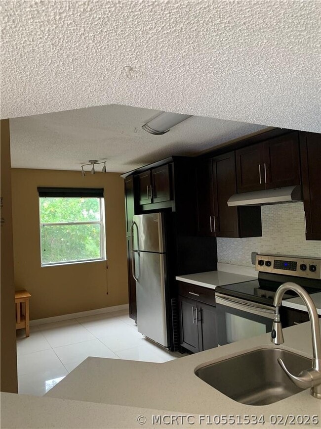 Building Photo - 8891 Wiles Rd Unit 308