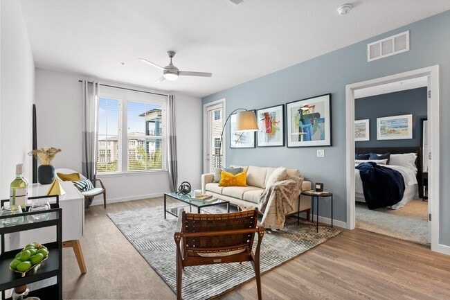Living Room and Balcony View - Gateway at Pinellas Apartments