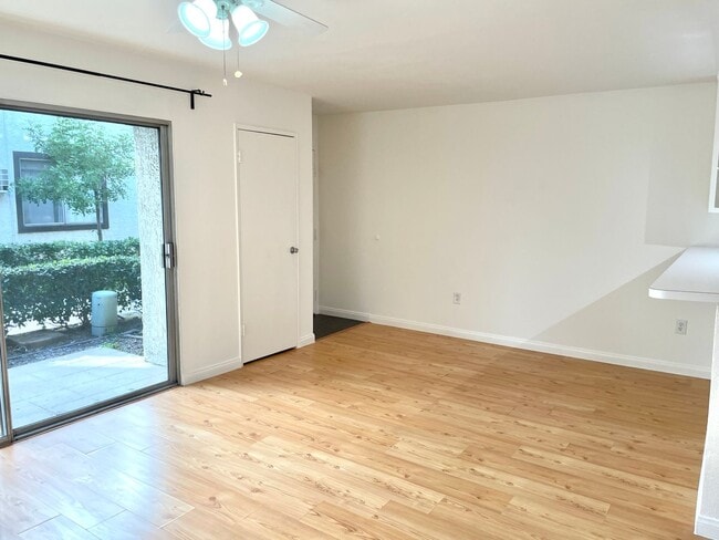 Photo - Beautiful 1 Bed/1 Bath Condo Apartment with Private Patio, Hardwood Flooring, Pool, and AC