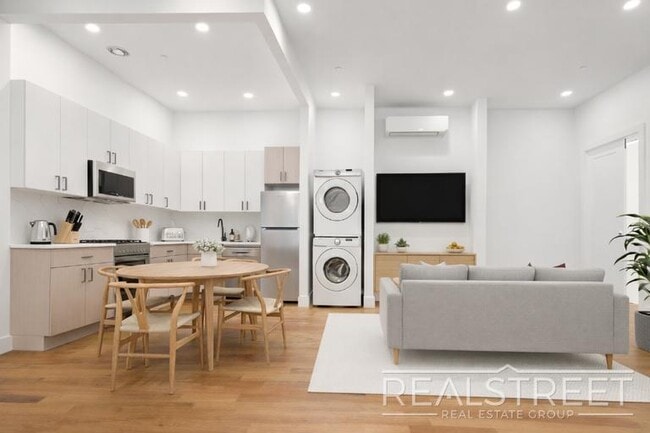 Photo - Brand New 4 Bed, 2 Bath with In-Unit Laundry, Private Balcony & Central Air