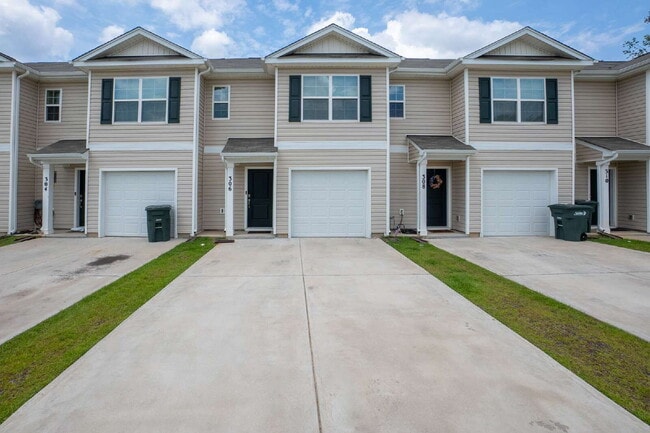 Building Photo - Partially furnished and now available!