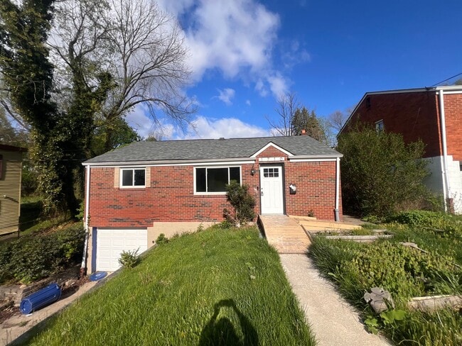 Photo - Comfortable 3-Bedroom Ranch with Yard, Garage & Bonus Basement Space