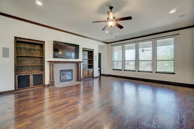 Photo - Stunning 4-Bedroom Home with Fireplace, Island Kitchen, 3-Car Garage & Large Backyard!