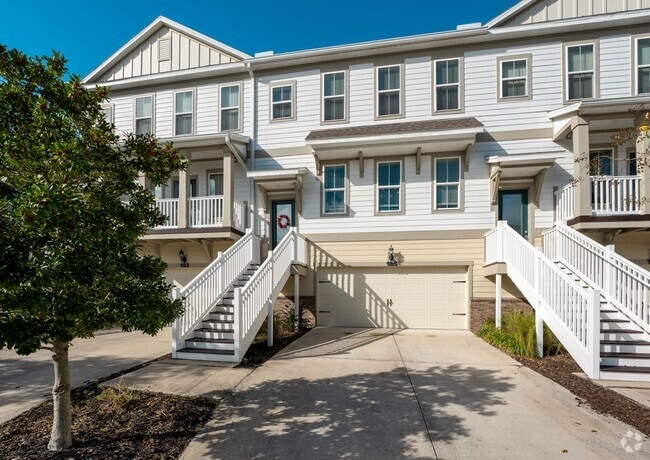 Building Photo - Introducing a captivating 3-story townhome...