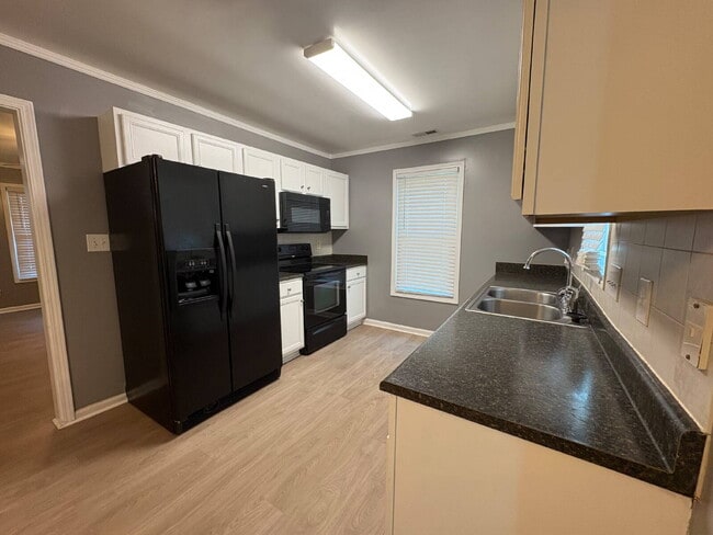 Photo - Spacious 4-Bedroom Sanctuary with Cozy Fireplace on Chimney Swift Drive!