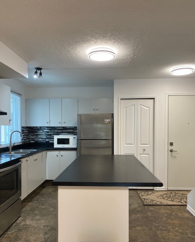 Photo - Charming 3-Bedroom Home with Extra Storage & Outdoor Parking Unit 502