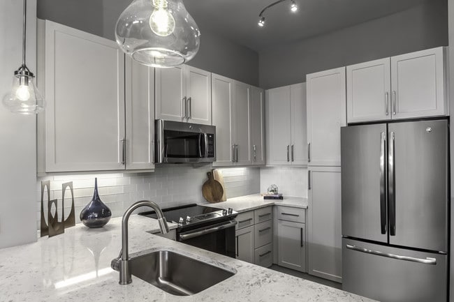 Premium quartz countertops with subway tile backsplash