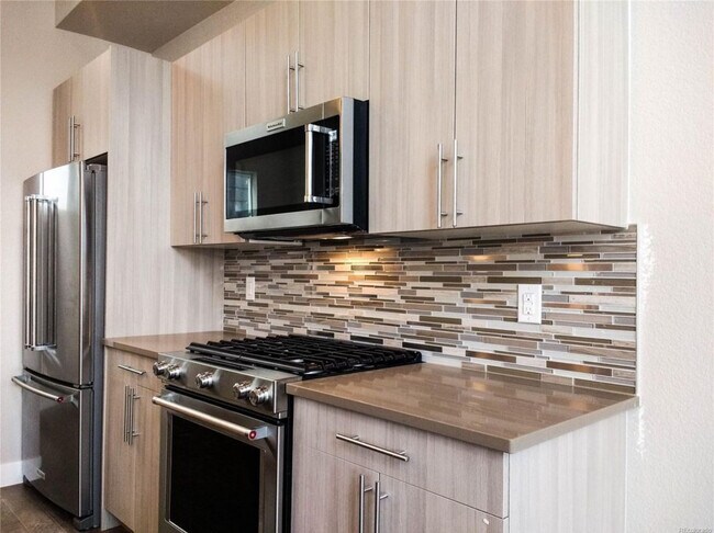 Kitchen, gas range, stainless steel refrigerator and dishwashwer - 2741 W 28th Ave