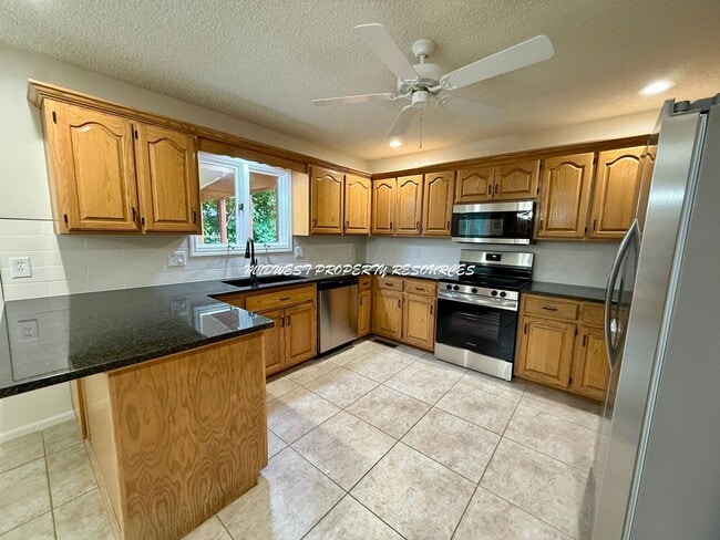 Photo - Spacious 3 Bedroom Home with Finished Basement, Covered Deck & Fenced Yard
