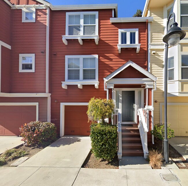 East facing entrance. Another parking space in driveway in front of garage. - 757 Seneca Ter Townhome