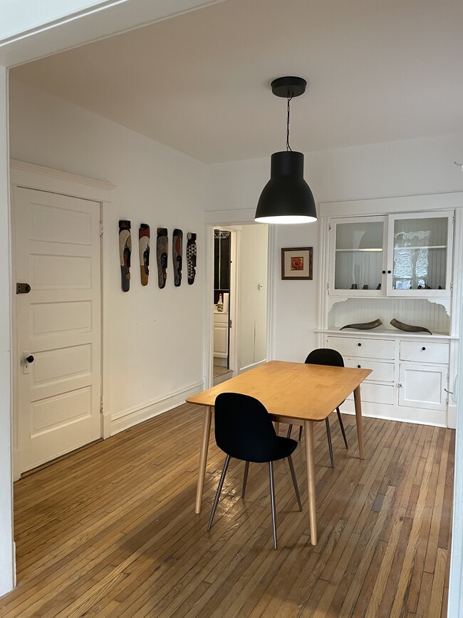 Dining room has an antique built-in for extra storage. - 3489 N Elston Ave Unit 2