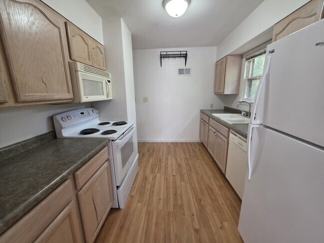 2 Bedroom, 1 Bathroom West Hill Home with Fenced Yard, Garage, & Bonus Living Space